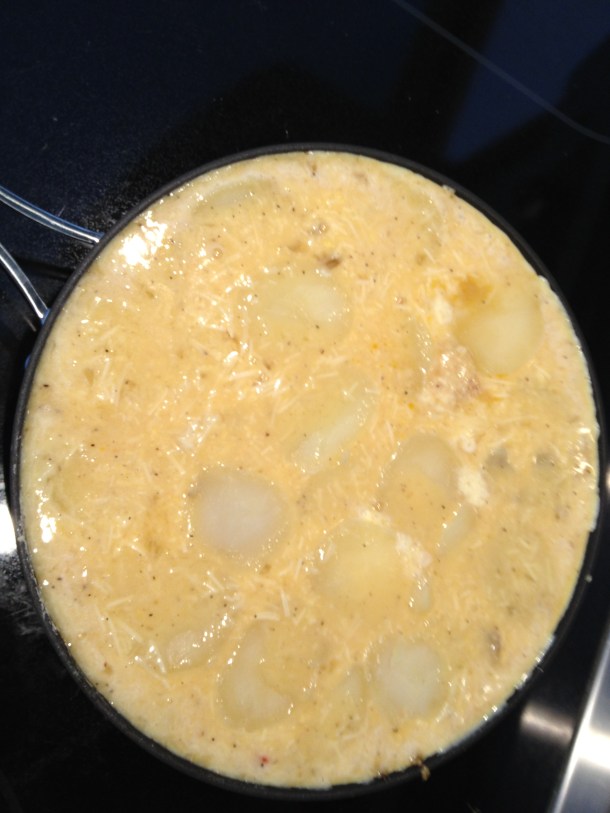 The tortilla initial cooking on the stovetop before baking