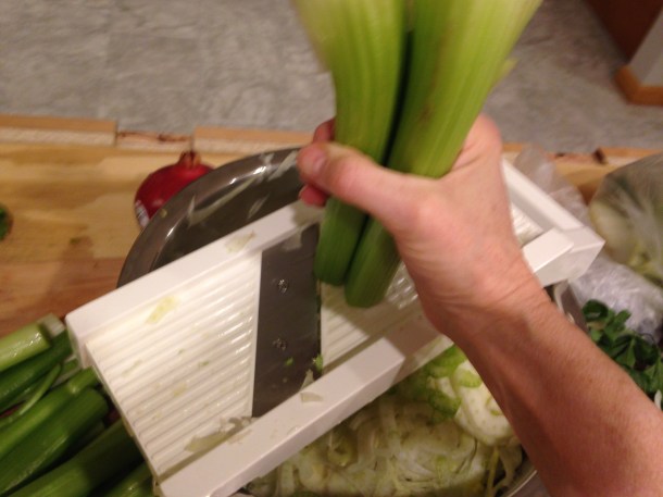 Slicing the celery 3 half stalks at a time