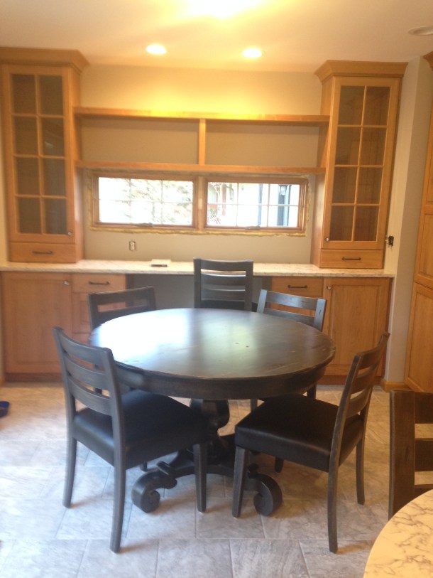 Glass Cabinets Placed Over Quartz Counters; Distressed Table and Chairs Are In!